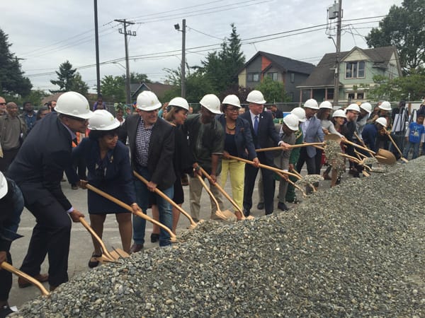  Photo by Ester Kim: The ceremonial dirt gets moved during the groundbreaking for Capitol Hill Housing
